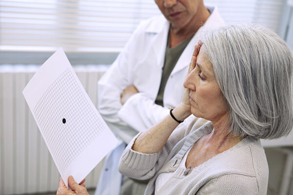 Woman Looking at an Amsler Grid